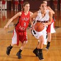 Siloam Springs’ Maci Lewis, right, heads to the basket as Vilonia’s Maggie Brewer defends during the...