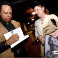 Art Burton speaks with Cheryl Carter of Fort Smith while signing a copy of his book Black Gun, Silve...