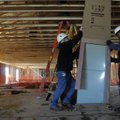 CONSTRUCTIVE BOOST Kim Doyle, left, and Maurice Hurt, both with Action Inc., unpack an air handler t...