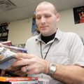 Take 2 Video manager Boyd Rubendall sorts through DVD movies at the video store on South Walton Blvd...