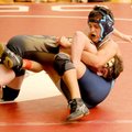 Springdale Har-Ber’s Antonio Guerrero, right, wrestles Bentonville’s Spencer McMurtrey during Saturd...