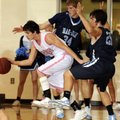 Bentonville’s Nick Michael, left, drives between Springdale Har-Ber’s Matt Toomer, center, and Micha...