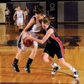 Fayetteville senior Tenille Briney, left, fights with Ponca City junior Jordan Hull for the ball in ...