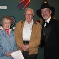 Artist Lawrence Robertson, from right, talks about his works with Vernon and Shirley Lott on Thursda...