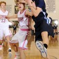 Springdale Har-Ber’s Matt Toomer, right, is fouled on his way to the basket by Bentonville’s Grant H...