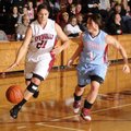 Springdale High’s Alex Light, left, moves toward the basket as Fort Smith Southside’s Ashley Cochran...