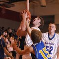 Springdale George Junior High’s Jordan Johnson goes up for a shot as Central Junior High’s Blake Wil...