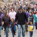 Laura Whitley walks Monday with her son Jackson, 6, her husband Marlen Whitley and their son Jordan,...