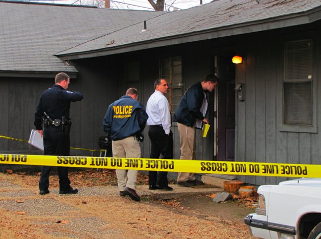 investigators-with-the-north-little-rock-police-department-enter-the-scene-of-a-home-invasion-stabbing