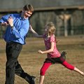 You’re it Chris Haas of Fayetteville is tagged by his daughter Maggie, 8, as they play Monday at Vet...