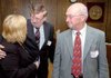 Roland Smith (center), the superintendent of the Greenland School District, and LeRoy Ortman, the superintendent of the Decatur School District, thank Hazel Burnett after the state Board of Education voted to remove both districts from state control. Burnett is the Arkansas Department of Education’s coordinator of fiscal-distress services.