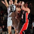 Gentry’s Kendra Boyd, left, puts a rebound up for two points over teammate Terra Jones and Gravette’...