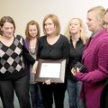 VOLUNTEER AWARD
Shannon Shoptaw, center, is surrounded by her colleagues Tuesday after a Volunteer ...