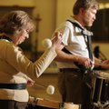 Barbara Scott plays the tenor drum as Red Sisson plays a snare drum during a rehearsal for the Ozark...