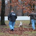Bella VIsta detectives Mike Kugler, left, and Ed Williams investigate the scene of a fatal shooting ...