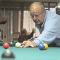 Boots Brehmer of Bella Vista shoots a game of snooker Thursday during a tournament at Riordan Hall i...