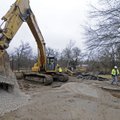 WORK AT GREATHOUSE PARK
Work crews relocating a natural gas line dig a hole in the parking area of ...