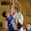 Bentonville Black center Nick Smith shoots over Rogers High’s Trevor Hampton, left, and Nick Wary, b...