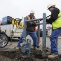 METER REPAIR
Tim Turner, left, and Dale Hutson, both lineman with Arkansas Western Gas Company, wor...