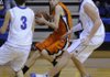 Southwest’s Austin Fox looks to pass as George’s Jordan Johnson, left, and Josiah Wymer defend in the first half of Thursday’s game in Springdale. 