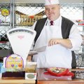 Michael Bishop stands for a portrait inside his shop, M.D. Bishop & Sons Candy Store, in downtown Ro...