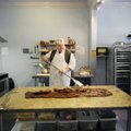 M.D. Bishop & Sons Candy Store proprietor Michael Bishop makes fudge Monday inside his shop in downt...
