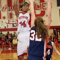 Fort Smith Northside’s Charmaine Whitmore shoots over Rogers Heritage’s Reba Johnson in the second h...