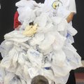 GREEN DEMONSTRATION - Tyler Lake, 11, helps Fayetteville High School Green Team member Anna Collin w...