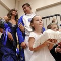 CROWNING ACHIEVEMENT - Amanda Coughlin is crowned Colors Day Queen on Friday by her father, Randy, d...