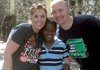 Lori and Noel Tugwell of Siloam Springs pose with their newly adopted son, Louis, in Haiti on Thursday. The family is scheduled to fly home today.

