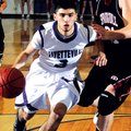 Fayetteville’s Kikko Haydar drives past Springdale High’s Joseph Kellogg on Jan. 12 in Fayetteville.