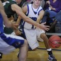 Rogers’ Wyatt Hively drives past Mt. Vernon’s defense in the first half of the Arvest Hoopfest Class...