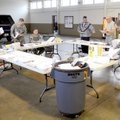 Guardsmen with the 1/142 Division Field Artillery’s Battery A hold a staff meeting Friday at the Nat...