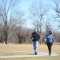 Steve and Virginia Helm of Farmington walk Friday around the trail at Creek Side Park in Farmington....