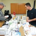 PACKING UP - Dr. Lance Faddis, left, and John Caubble, executive pastor at First Baptist Church in R...