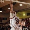 Springdale High sophomore guard Tony Dennis puts a shot up in front of Bentonville sophomore guard M...