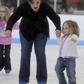 Laura Eppes helps Jacie Magie, 3, along the ice during an ice skating lesson Saturday at the It’s Gr...
