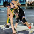 Fayetteville’s Bryan Arroyos, top, tries to take down Parkview’s Joey Fetty in the Springdale Wrestl...