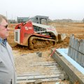 Bill Schoepf from JKJ Architecture watches a crew Friday prepare to pour concrete for a bathroom fou...