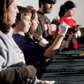 NEEDS MORE HANDBELL - Katie Jackson, left, handbell director for First Presbyterian Church in Fayett...