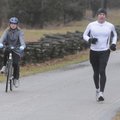 TRAINING DAY - David Sheets, right, runs Sunday while his daughter, Allison Sheets, 11, bikes the lo...
