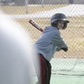 BATTER UP! - Dylan Henderson, 8, swings at a pitch from his father, Ryan Henderson, while taking bat...