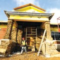 Martinez Braulio replaces bricks used from Old Main on the Huntsville Middle School building during ...