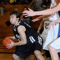 Bentonville Black’s Chase Kelly rebounds the ball during Monday’s game against Springdale Central in...