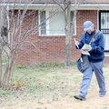 Mail carrier Jim Woolsey walks against a north-northwest wind gusting to 34 mph and a temperature of...