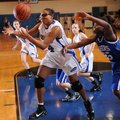 Fayetteville Woodland’s Turquoise Early, left, and Rogers High’s Taylor Strickland vie for a loose b...
