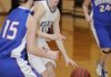 Elkins’ Holly Dingledine dribbles the basketball past Mountainburg’s Taylor Morton in the first half of Tuesday’s game in Elkins.
