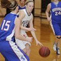 Elkins’ Holly Dingledine dribbles the basketball past Mountainburg’s Taylor Morton in the first half...