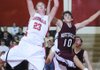 Farmington’s Jason Purdy rebounds the ball over Huntsville’s Tucker Trumbo in the second half of Tuesday’s game in Farmington.
