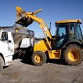 Tim Burton dumps sand into the bed of a truck Tuesday at Springdale Public Works on Randall Wobbe La...